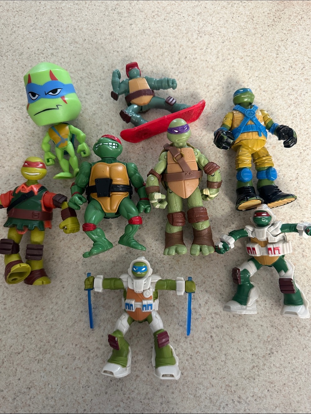 lot of 8 Teenage Mutant Ninja Turtles action figures,